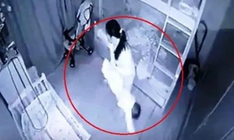 Người giúp việc cầm chân bé gái 13 tháng tuổi dốc ngược vì không chịu ngủ