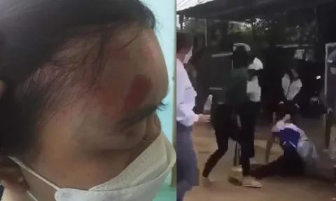 Nữ sinh lớp 11 bị nhóm người đánh hội đồng dã man trước cổng trường