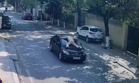 Tạm giữ Phó giám đốc trung tâm giáo dục thường xuyên hất CSGT lên nắp ca pô