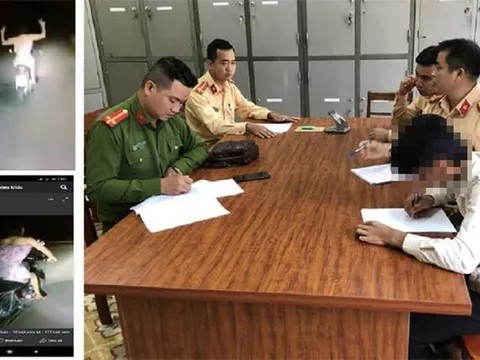 Xử phạt nam thanh niên mặc váy hồng, buông hai tay khi lái xe